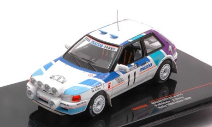 Immagine di MAZDA 323 GTX N.11 1000 LAKES RALLY 1990 W/NIGHT LIGHTS MIKK./HERTZ 1:43